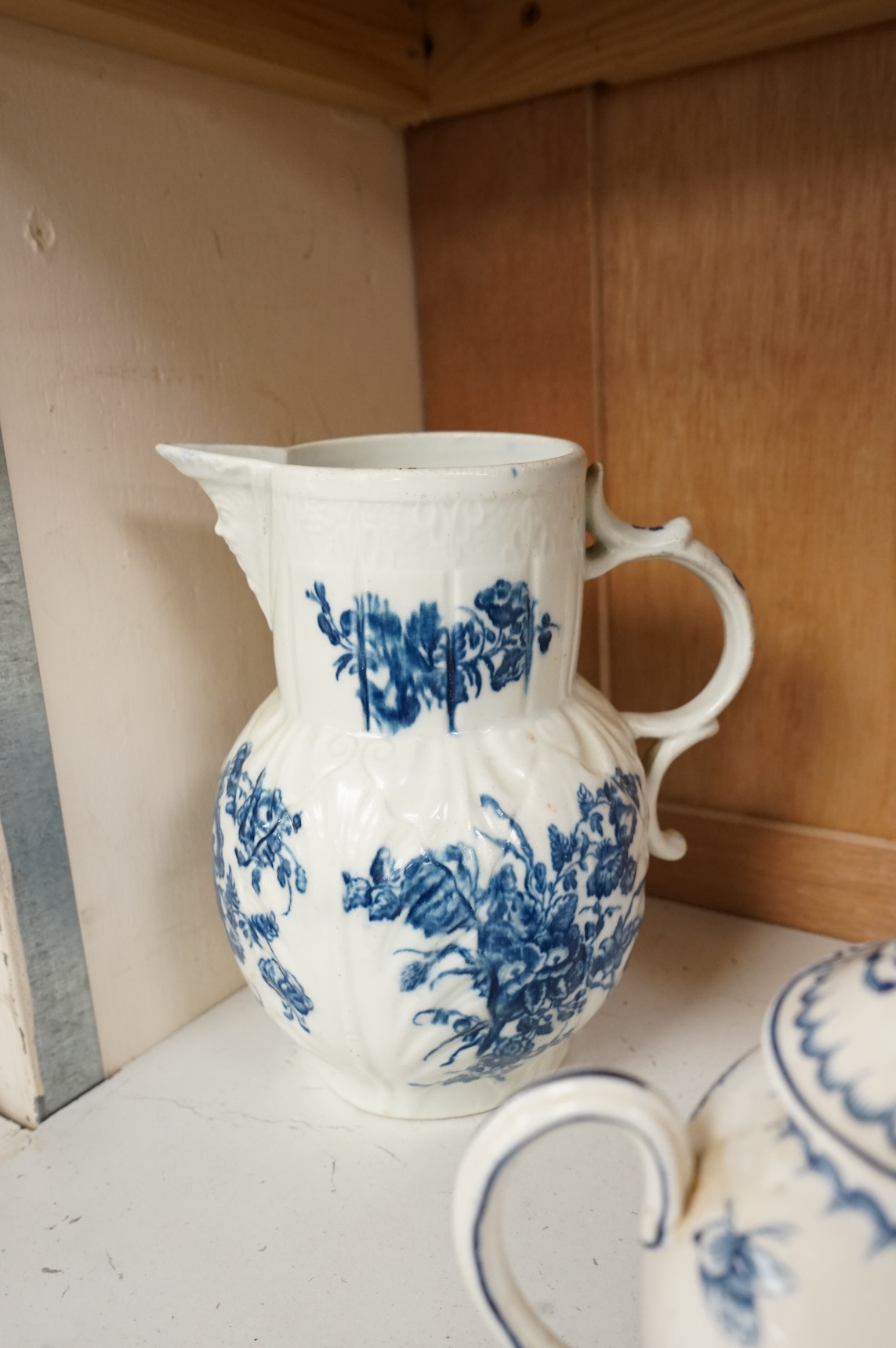 An 18th century blue and white Worcester jug and assorted Booths Worcester style tea wares, largest 24cm high
